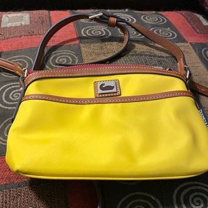 Dooney & Bourke yellow nylon crossbody bag. In great shape
